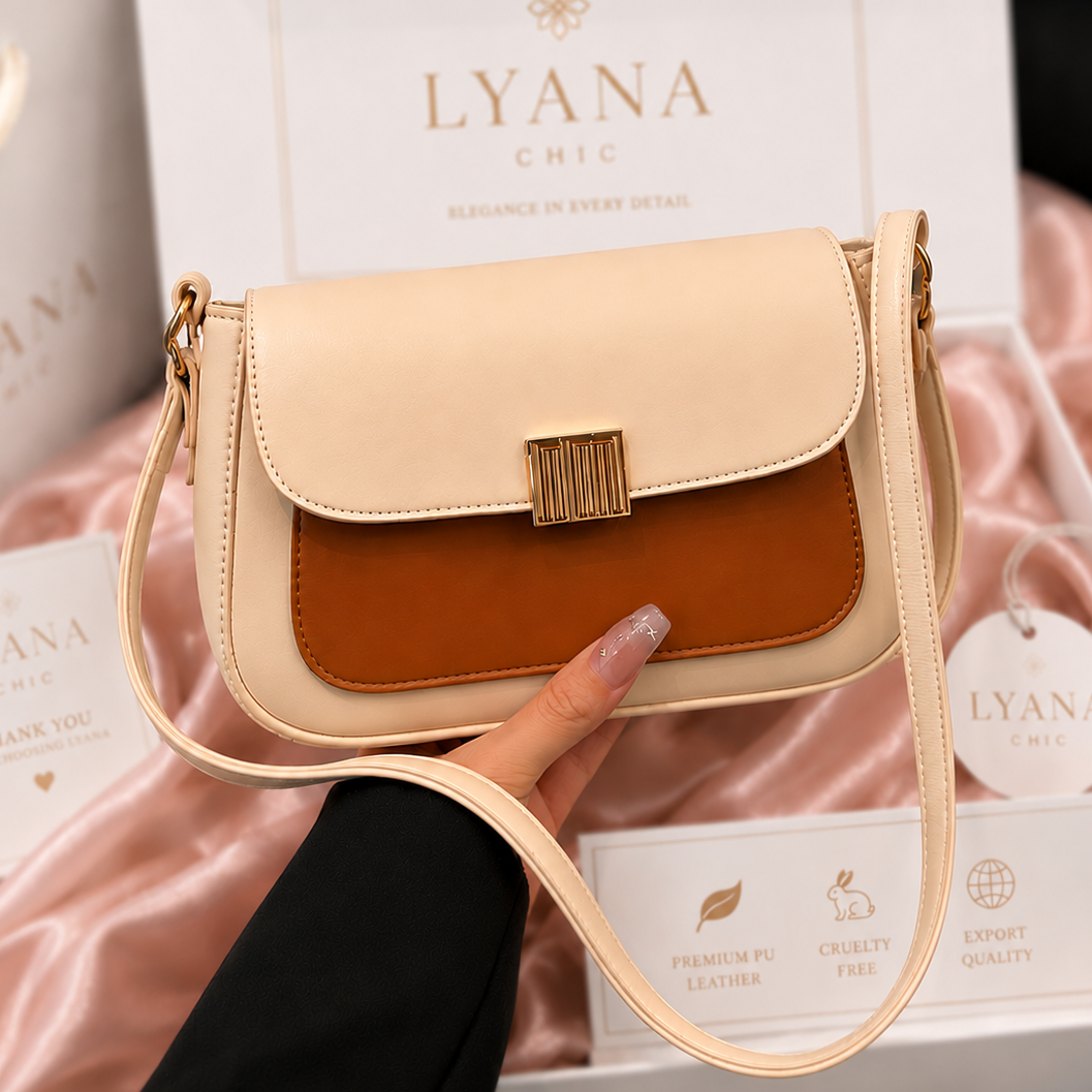 Beige and brown handbag held by a hand with LYANA branding in the background