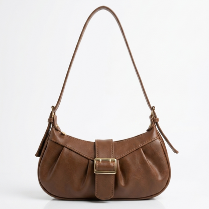 Lyana Brown pinterest handbag with a gold buckle on a white background